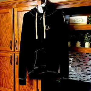 A True Religion zip-up hoodie, size Large, Black & Gray.